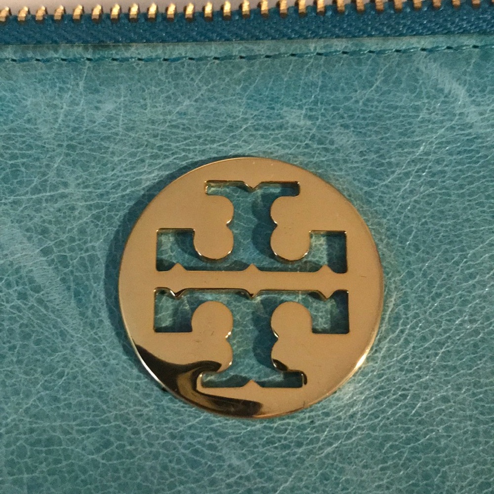 Tory Burch blue wristlet. gold logo. Authentic